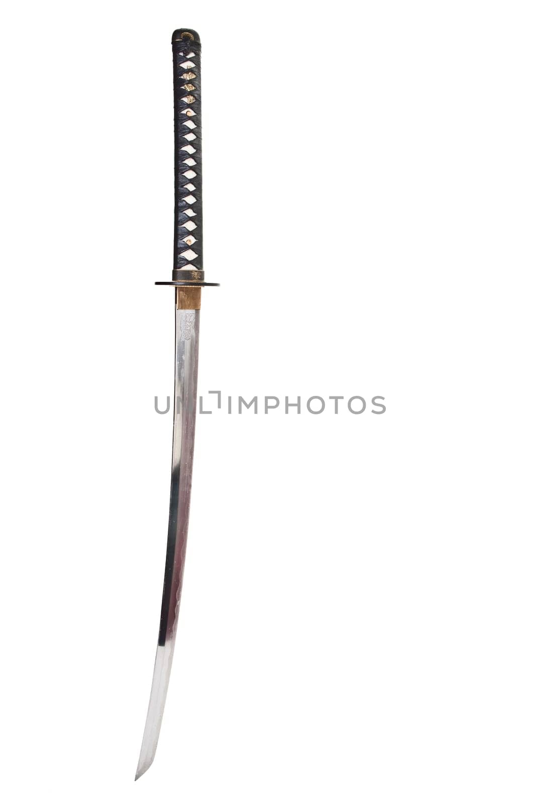 Detail from the very sharp steel blade on a Japanese Samurai sword or Katana.  The blade has to be constantly kept waxed to protect against oxidization and to retain sharpness.
