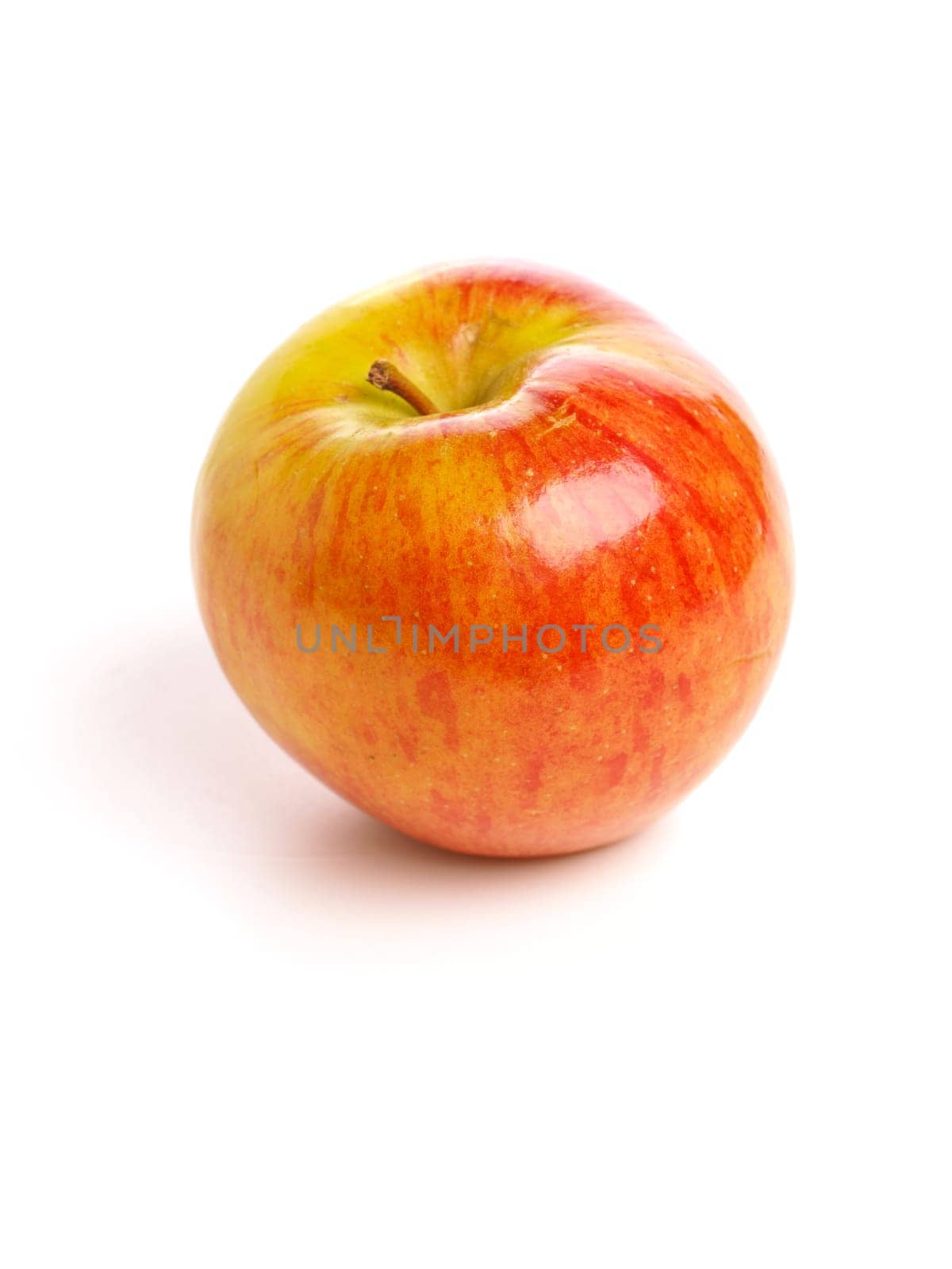 Big organic apple on a white studio background, healthy eating or fresh food