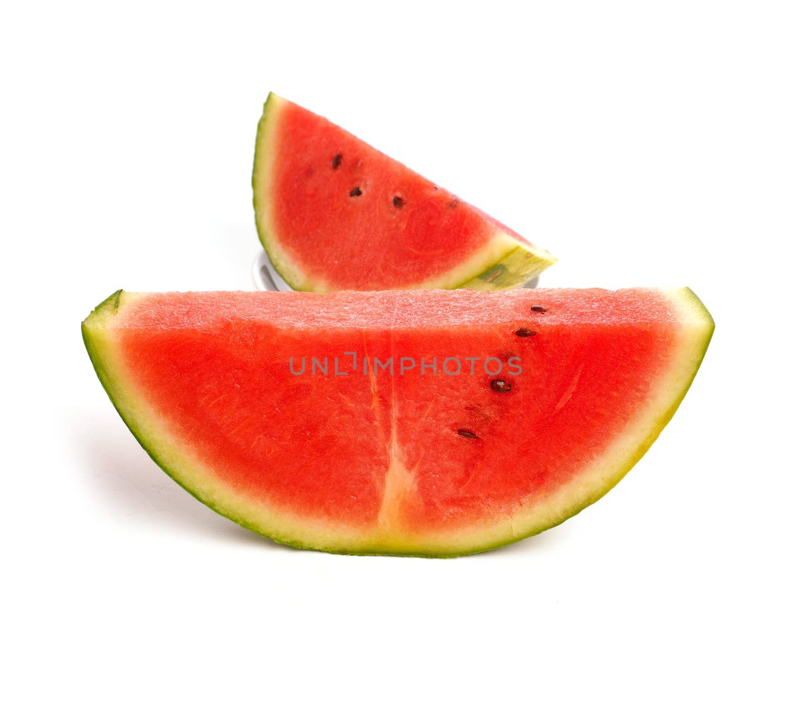 Two pieces fresh organic watermelon on a white studio background, healthy eating or diet concept