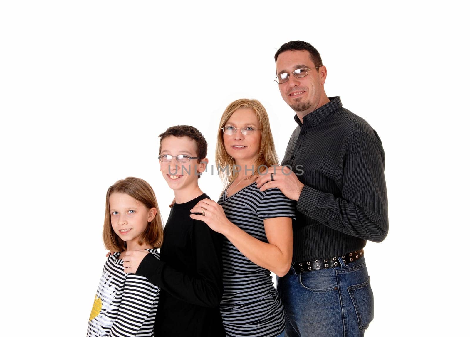 A young family wit two kids standing in profile in frond of each other, .isolated on white background..