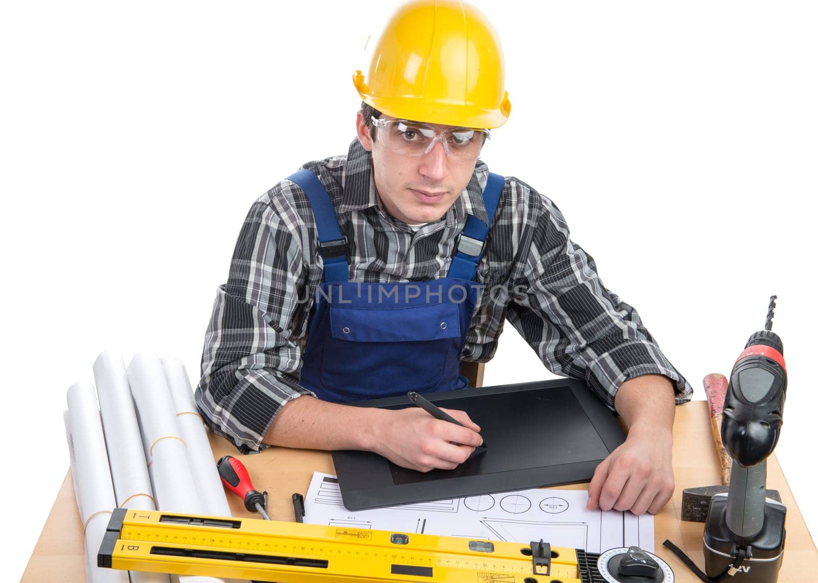 a young worker with a tablet in his office