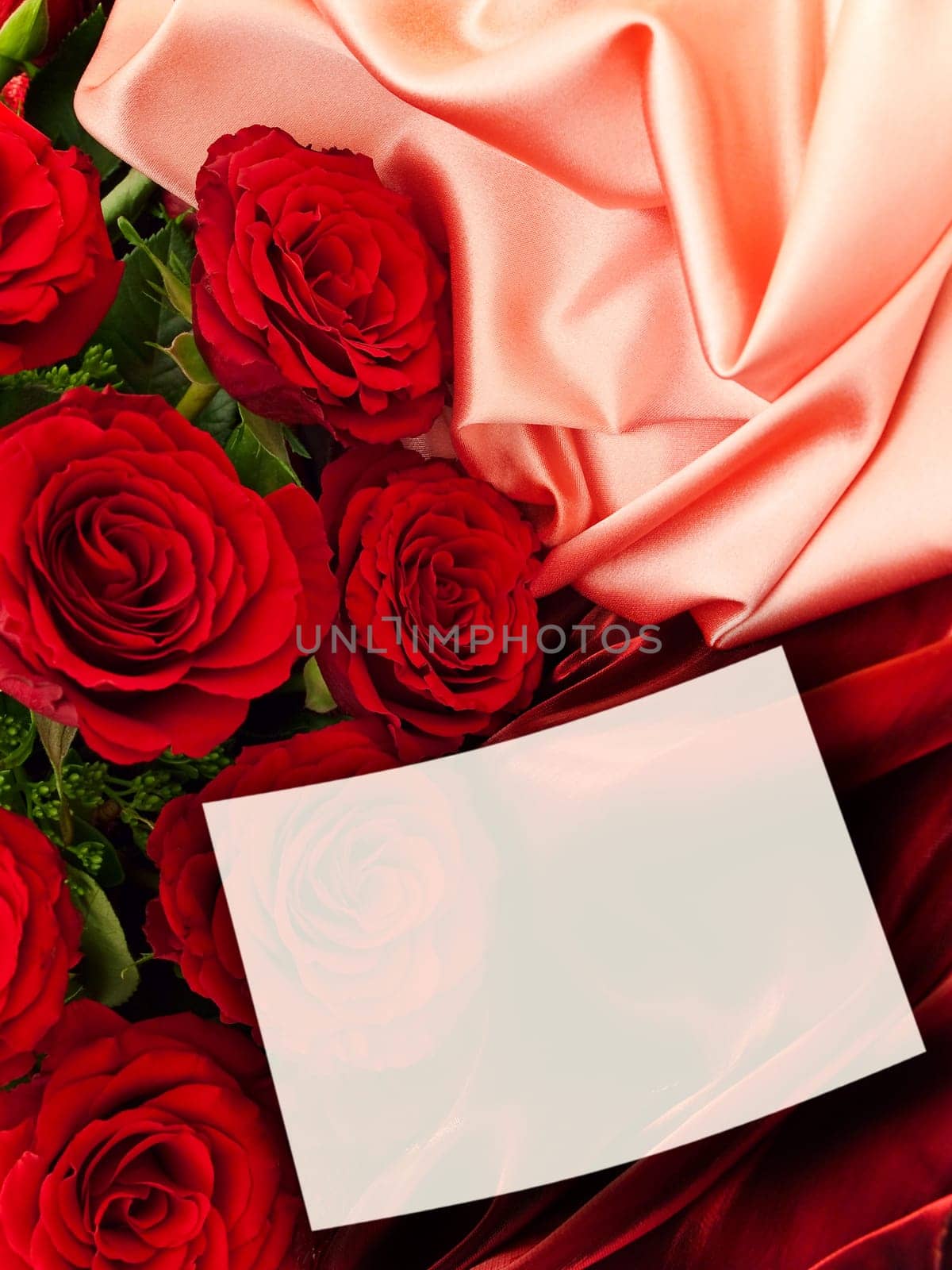 Red Roses With White Greeting Card At Fabric