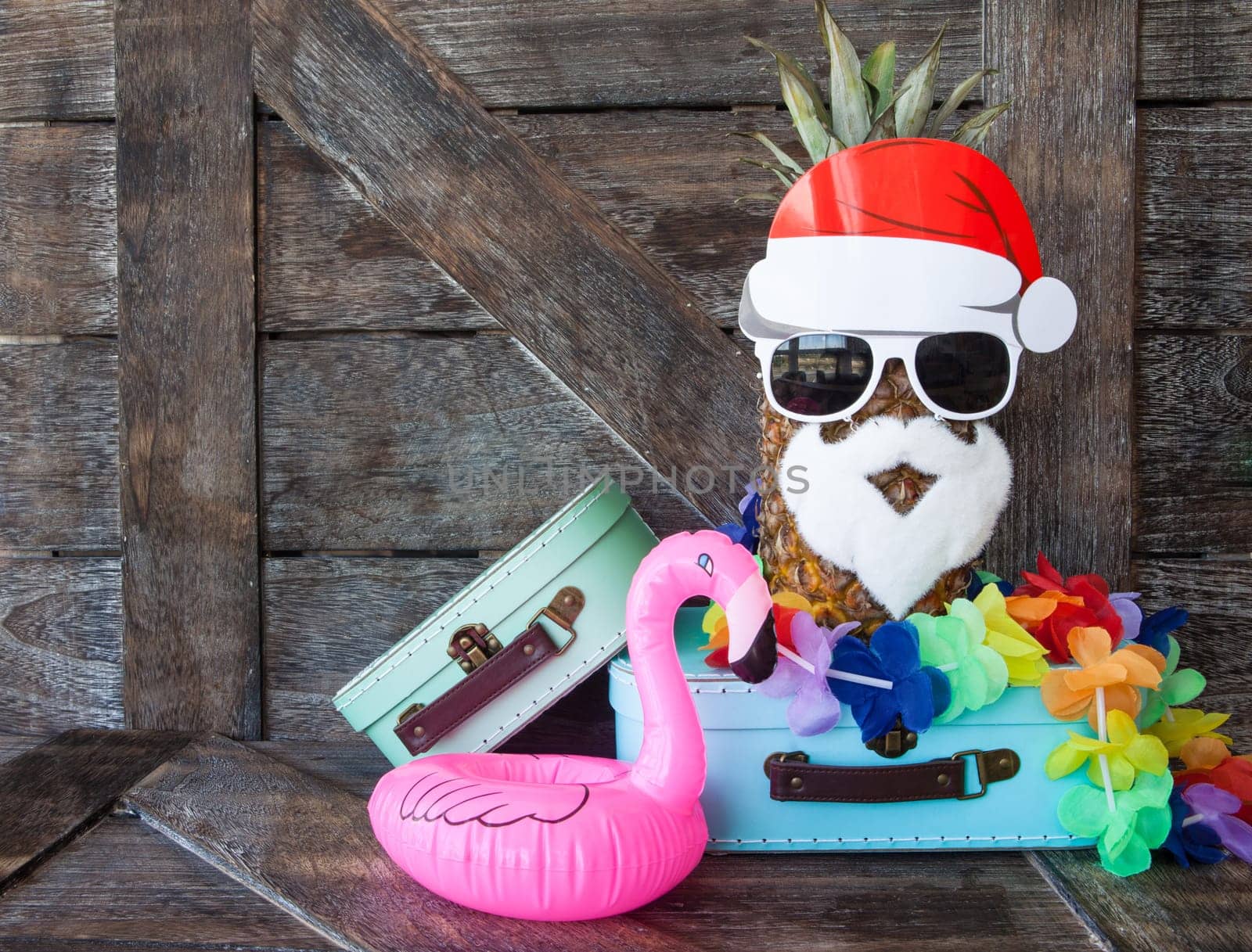 Beach holiday / travel concept for Christmas on rustic wooden background