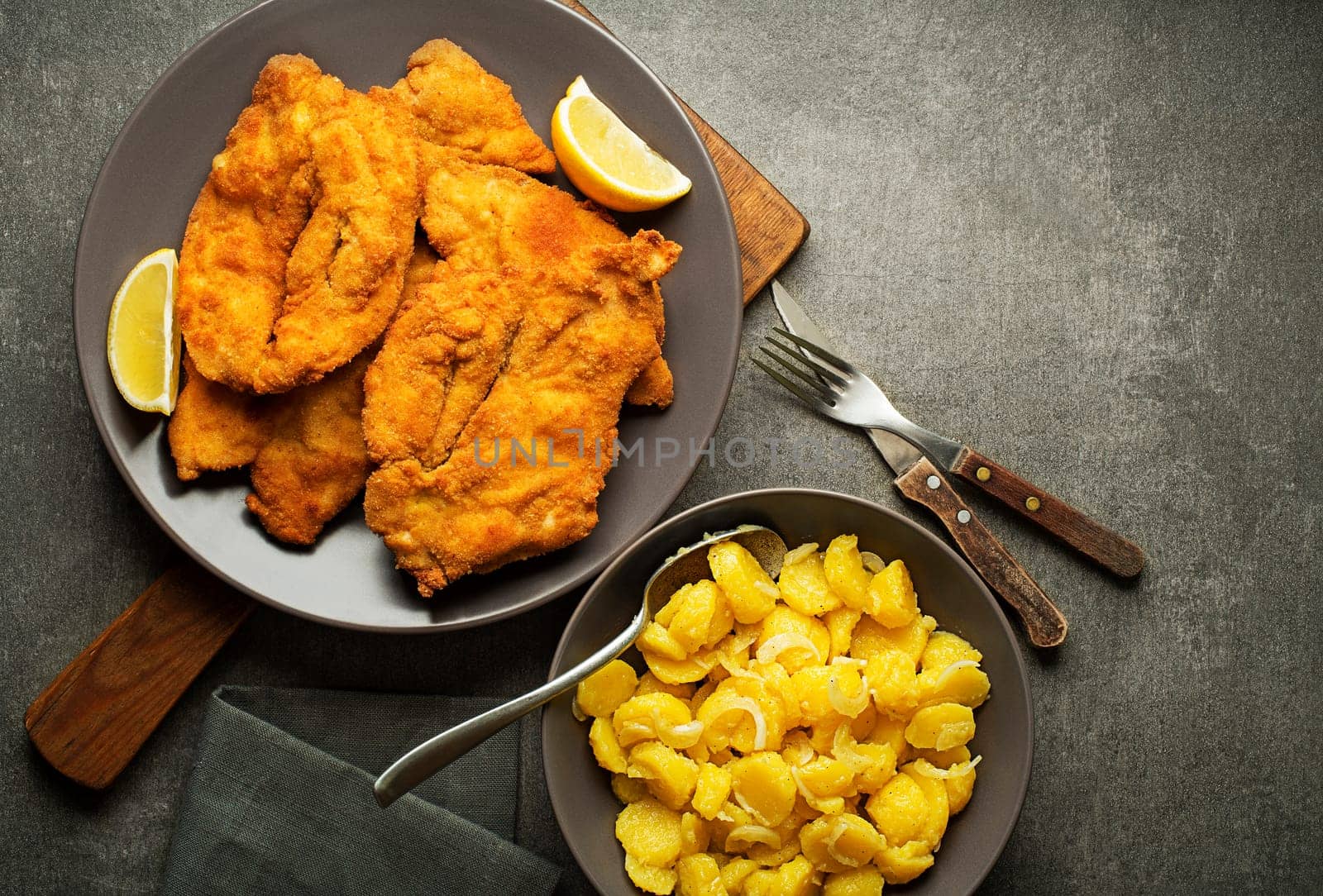 Homemade breaded or fried chicken steak - German Weiner Schnitzel with potato salad