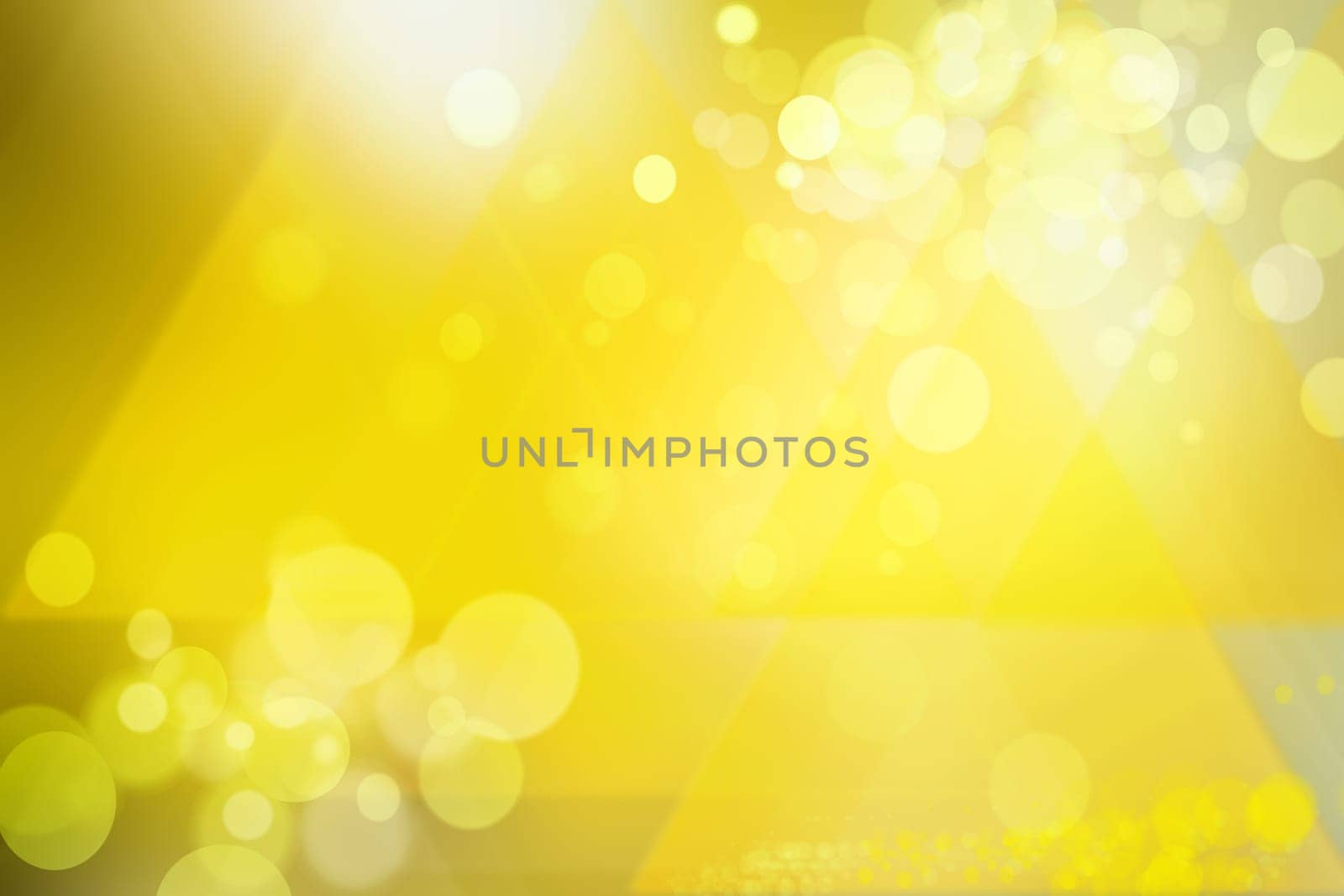 Abstract festive golden bokeh background with defocused lights. Christmas lights, blurry lights, glitter sparkle.