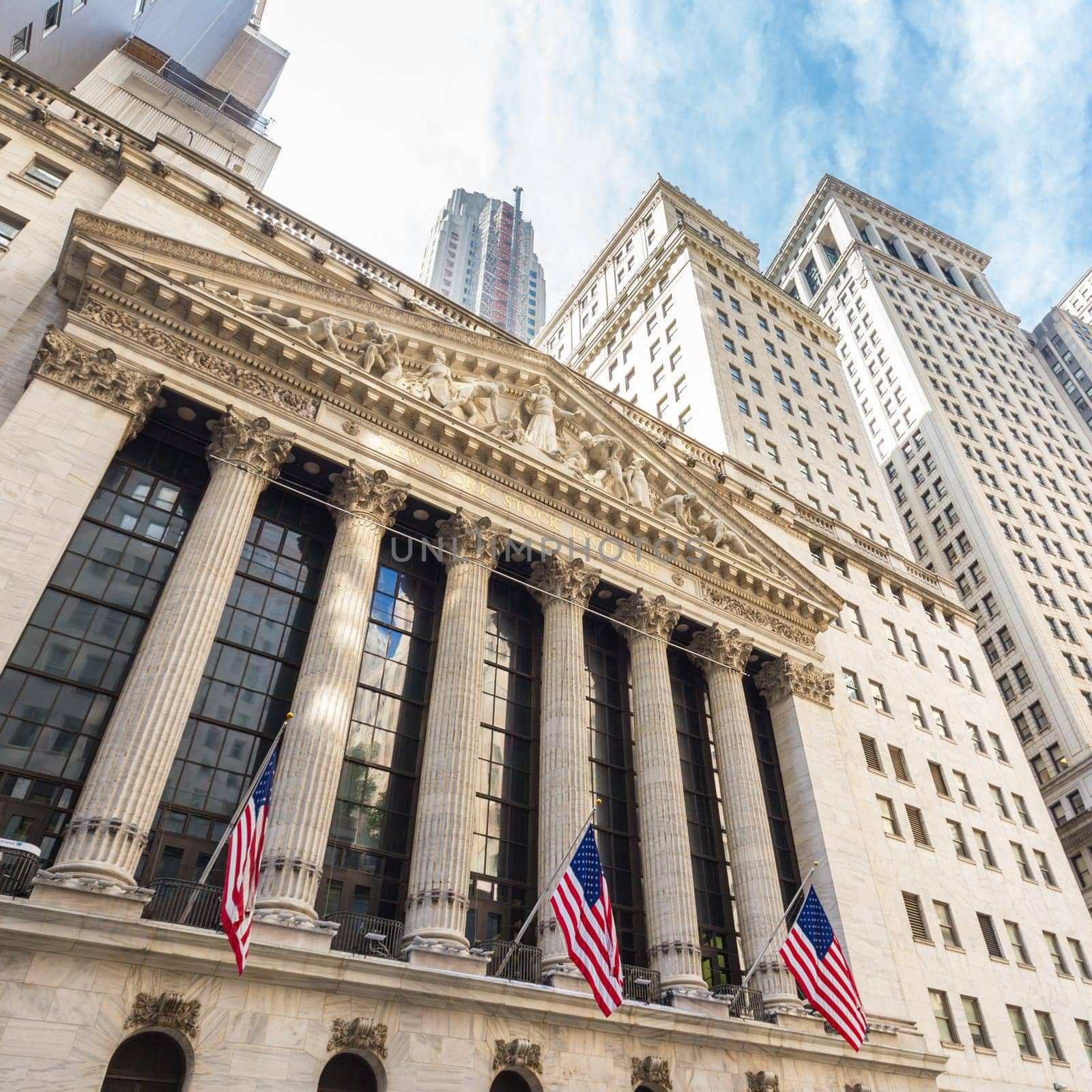 Exterior of New york Stock Exchange, largest stock exchange in world by market capitalization and most powerful global financial institute. Wall street, lower Manhattan, New York City, USA.