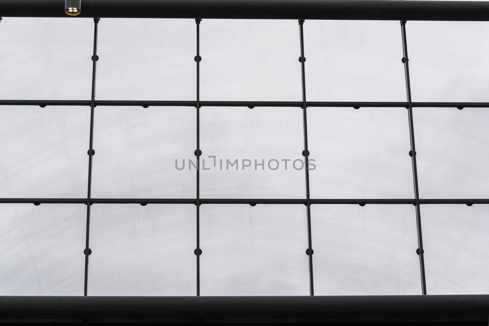 Modern office building with glass facade as a background.