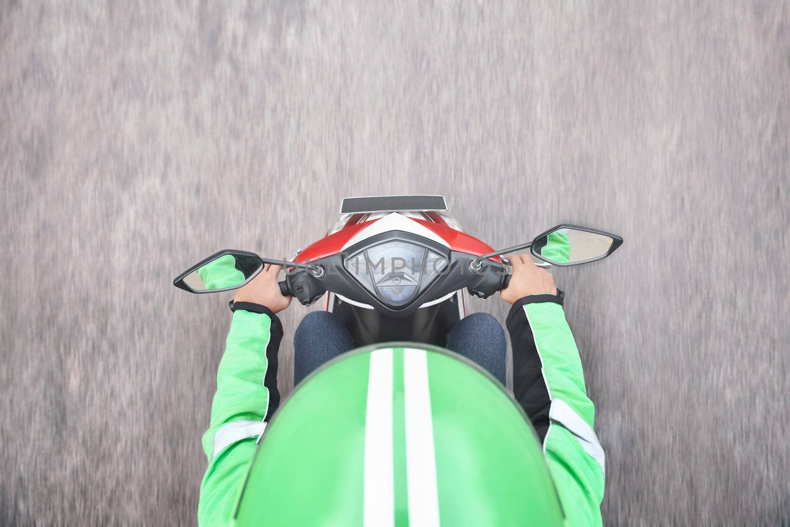Top view of motorcycle taxi driver on the street
