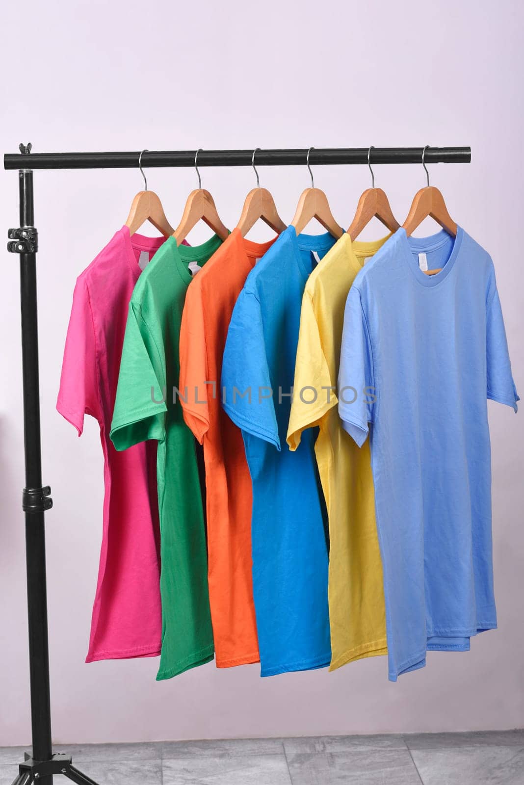 Colorful clothes with clothes hook on hang on a shelf home