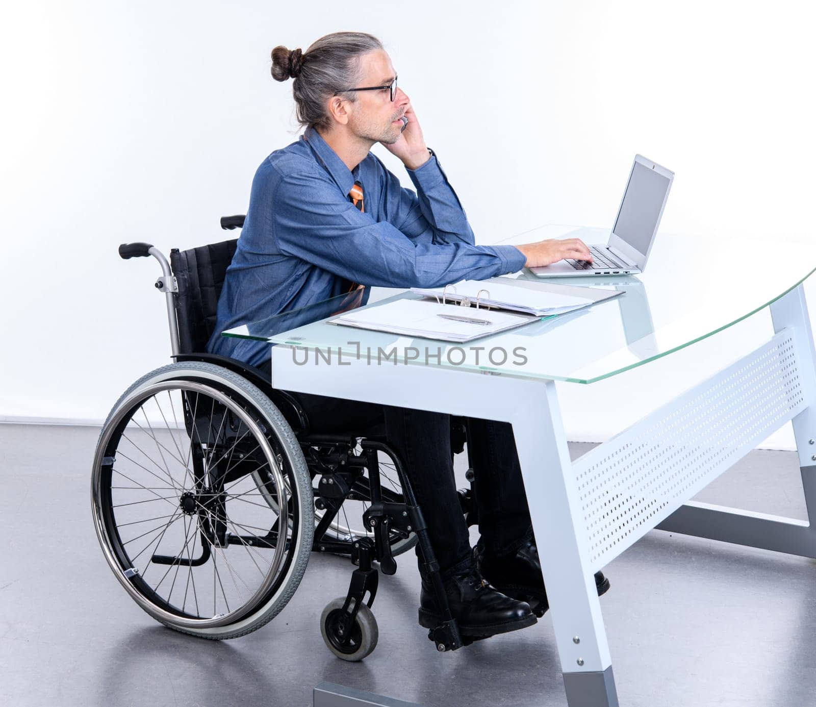disabled business man in wheelchair working  in the office