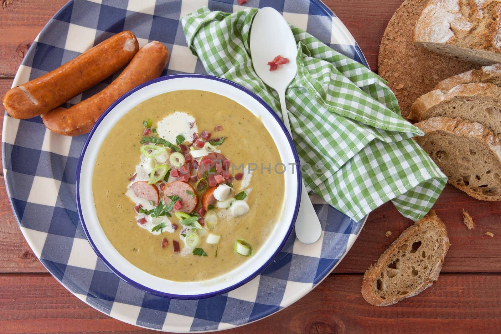 Hearty potato soup with smoked sausages and bacon