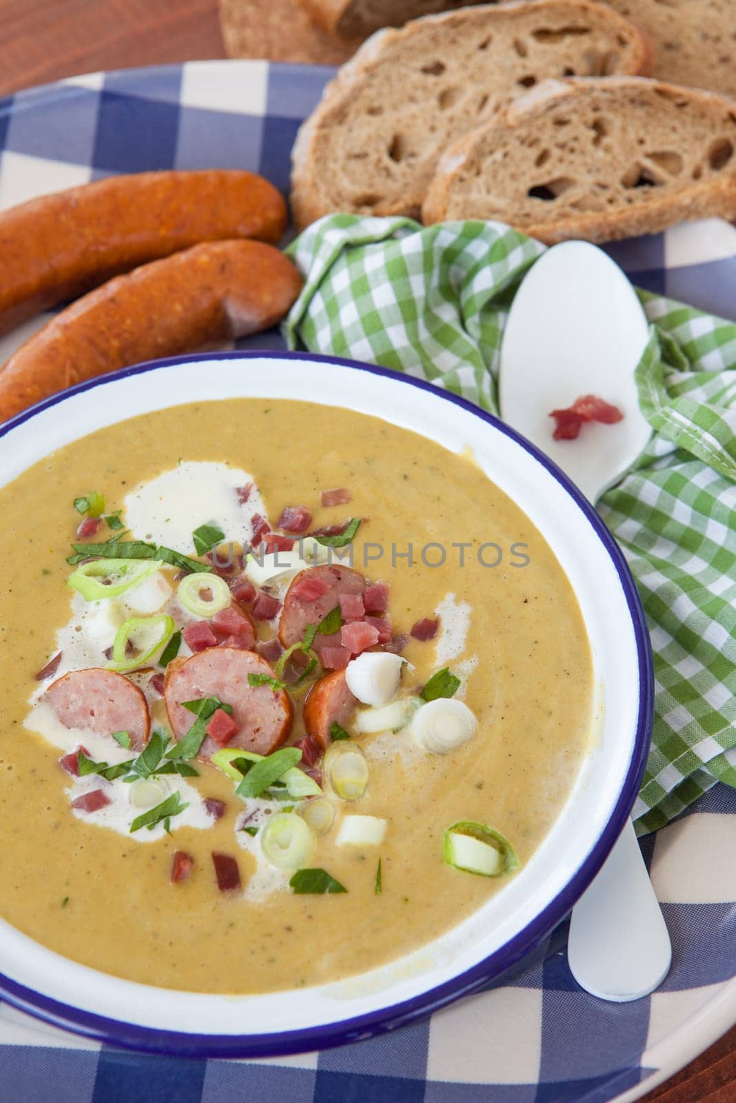 Hearty potato soup with smoked sausages and bacon