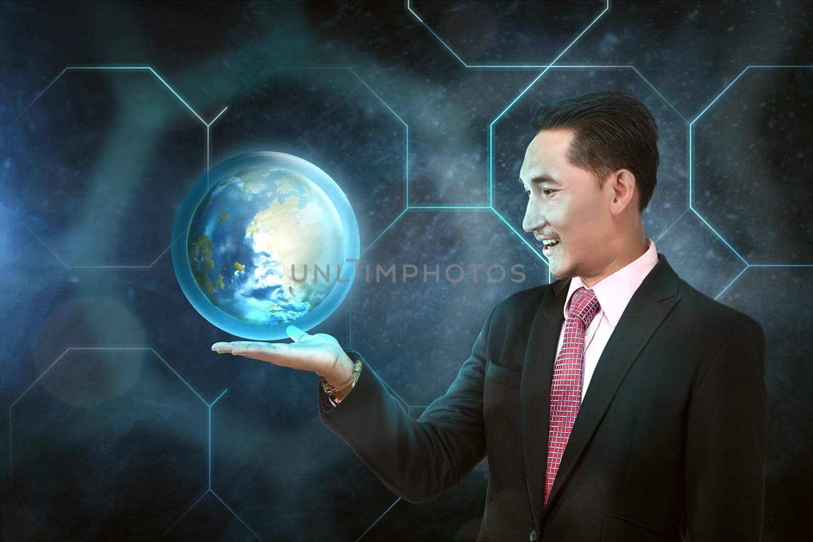 Asian businessman holding earth planet on his hand with outer space background