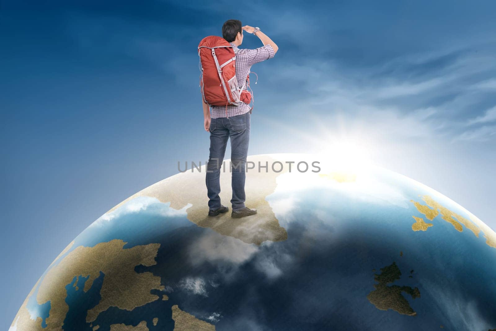 Rear view asian traveler man with backpack standing on earth planet looking at sunrise