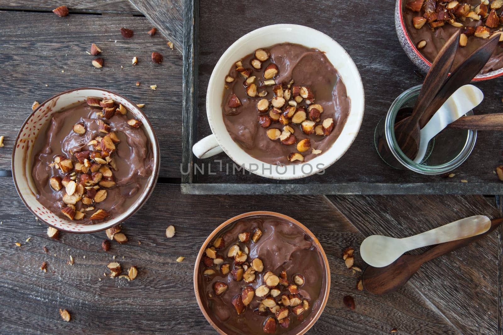 Delicious chocolate pudding with roasted almonds and caramel sauce