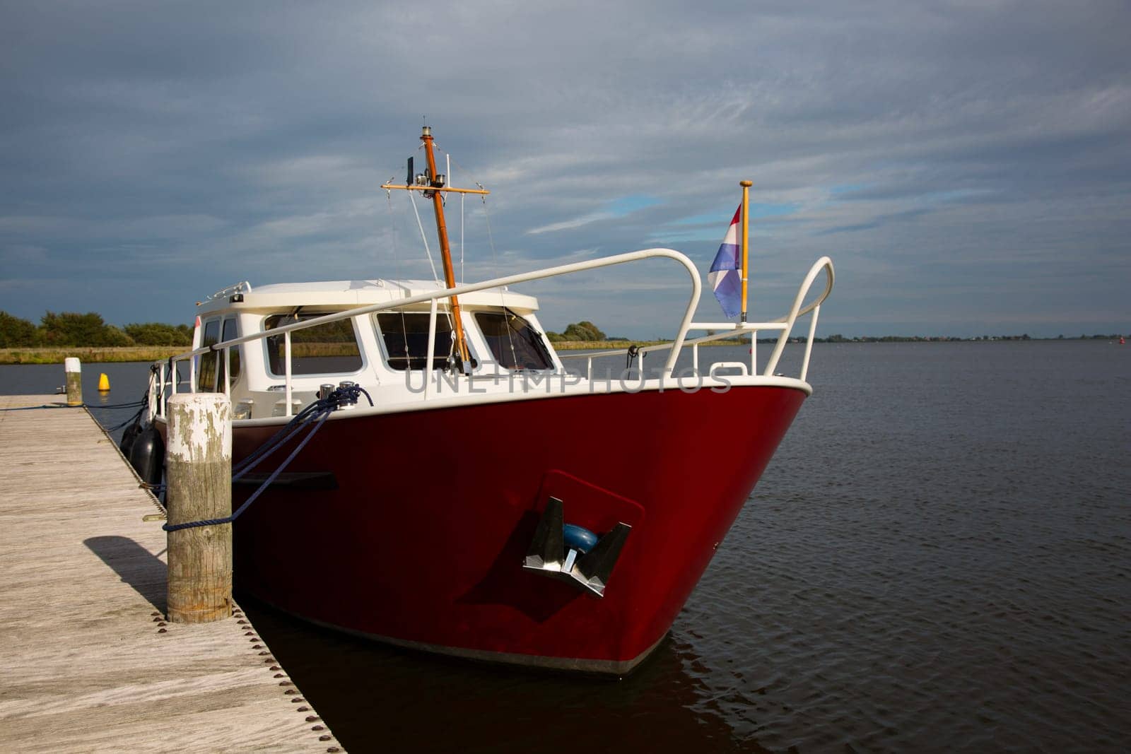 Dutch motorboat moored at the Alkmaardermeer Lake.