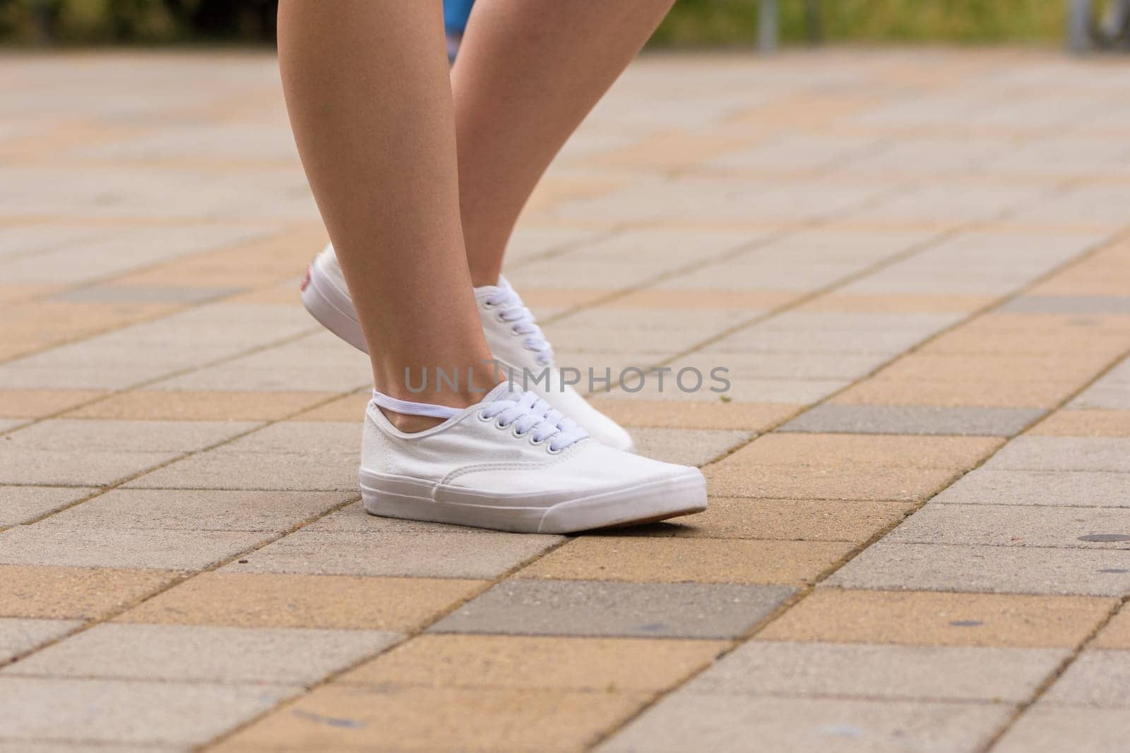 Female sneakers are dressed for a girl, close-up