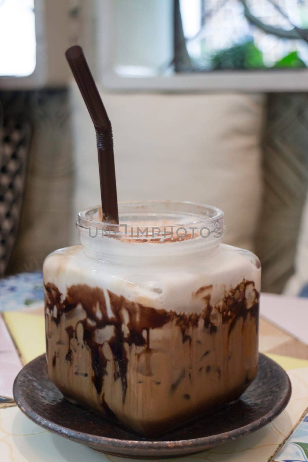Iced coffee mocha serving on table, stock photo