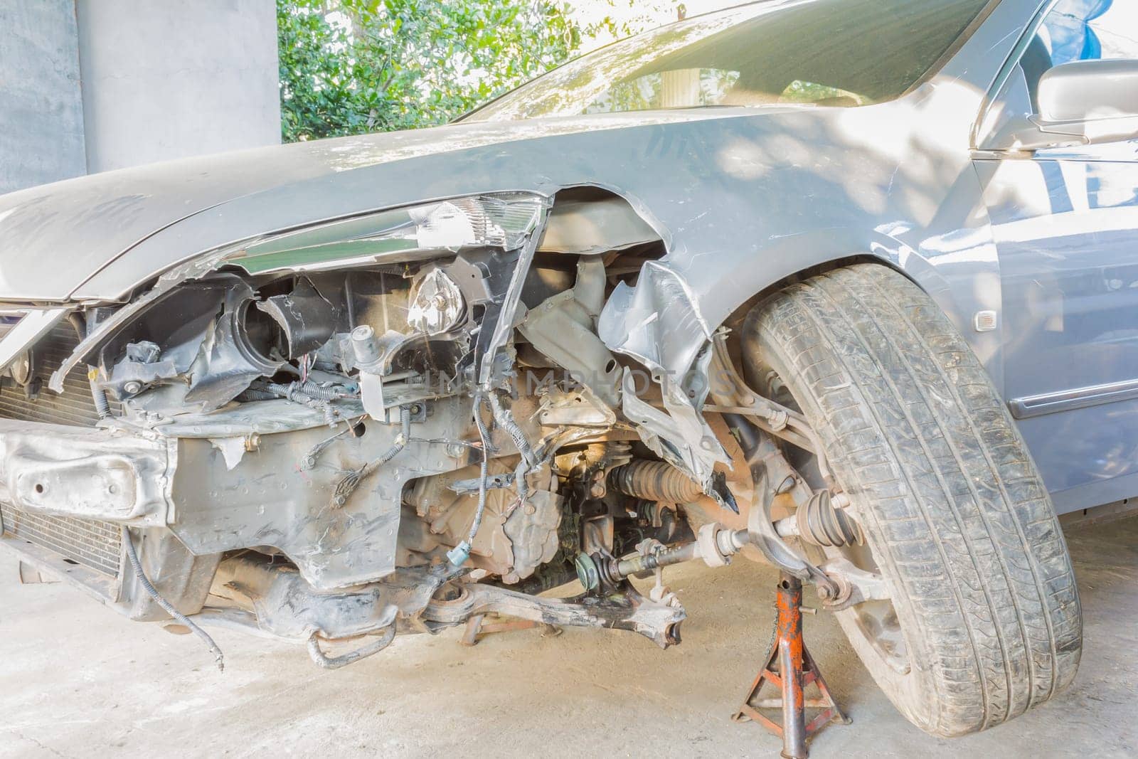 Car or automobile is crashed at front side or car insurance concept. Crashed car for car insurance story in car service shop or garage. Business in .term insurance category