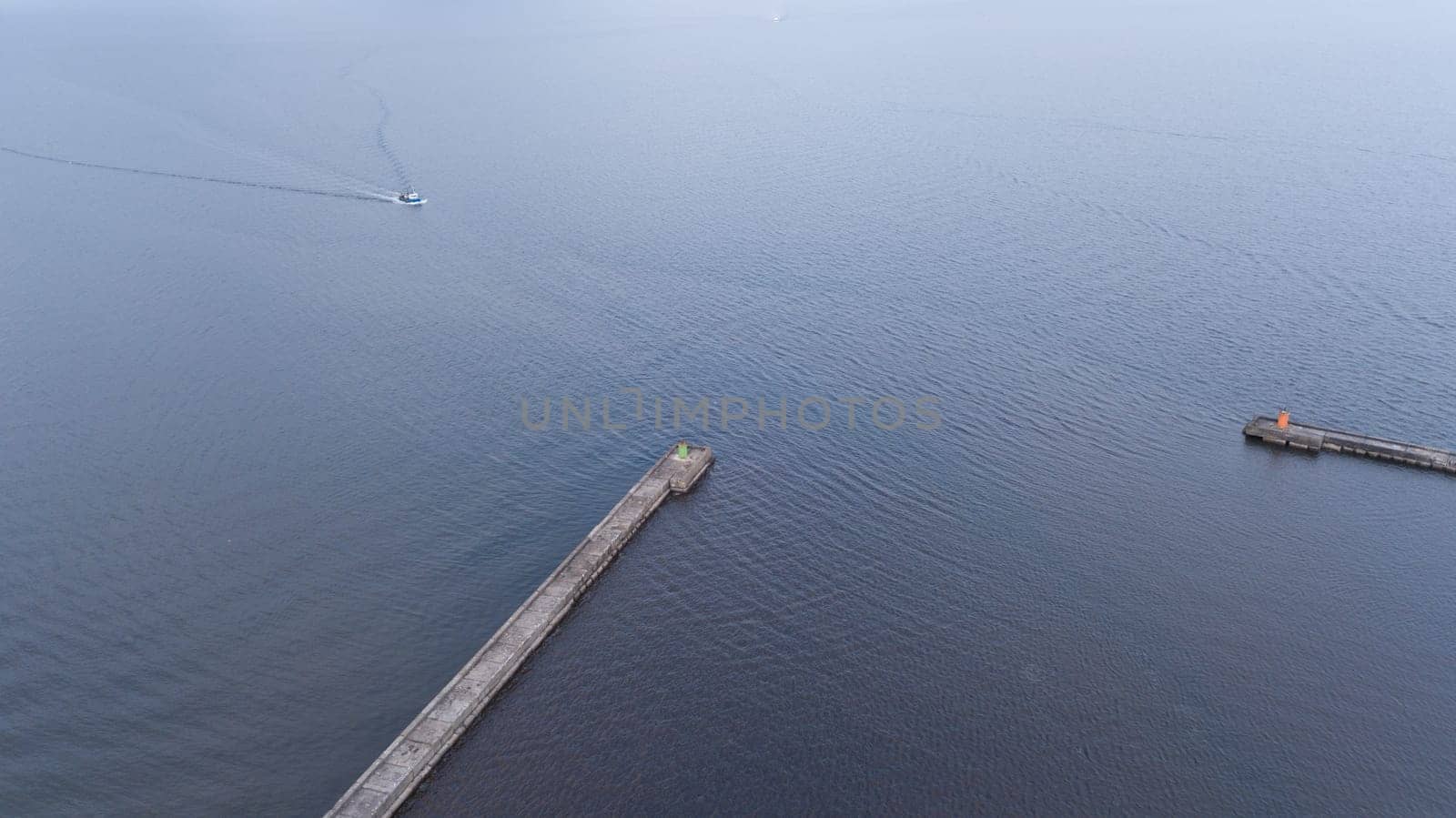 ship going in to Harbor Roja Latvia Aerial view of countryside drone top view