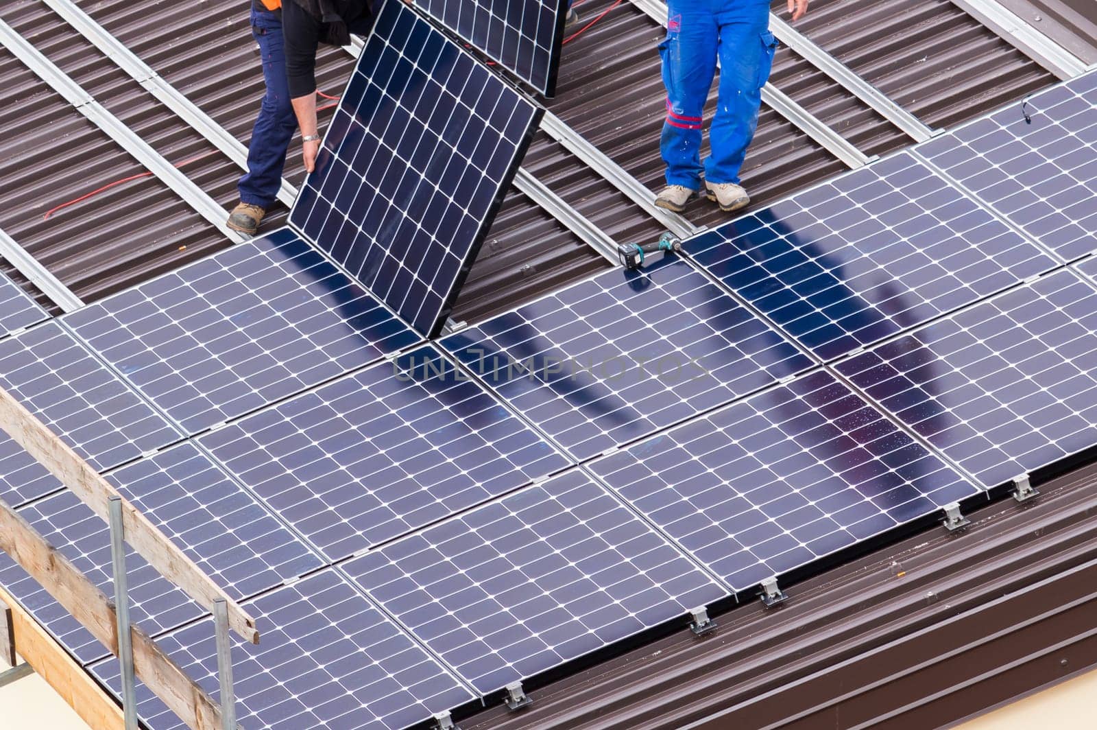Installation of solar panels on a roof.