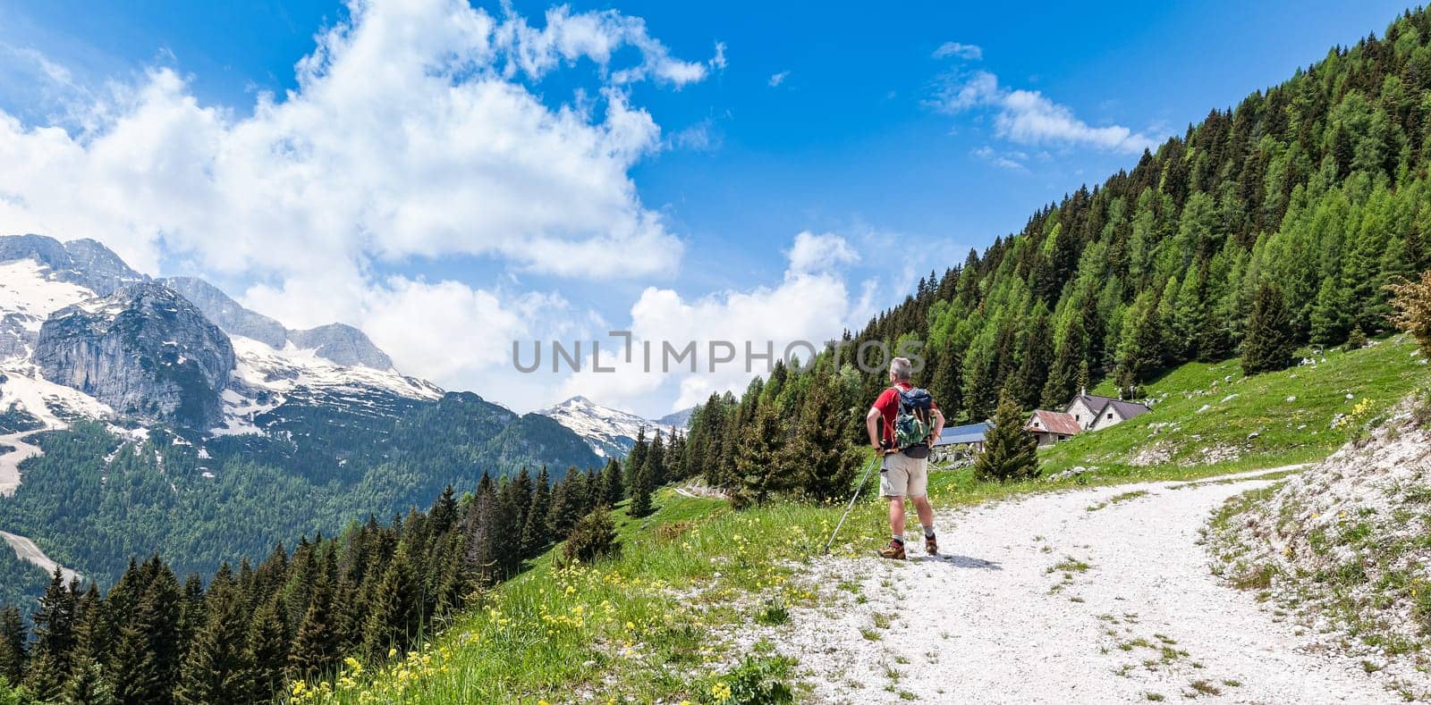 Mature hiker about 60 years old. Hiking  on mountains. Active retirement. Healthy Lifestyle.