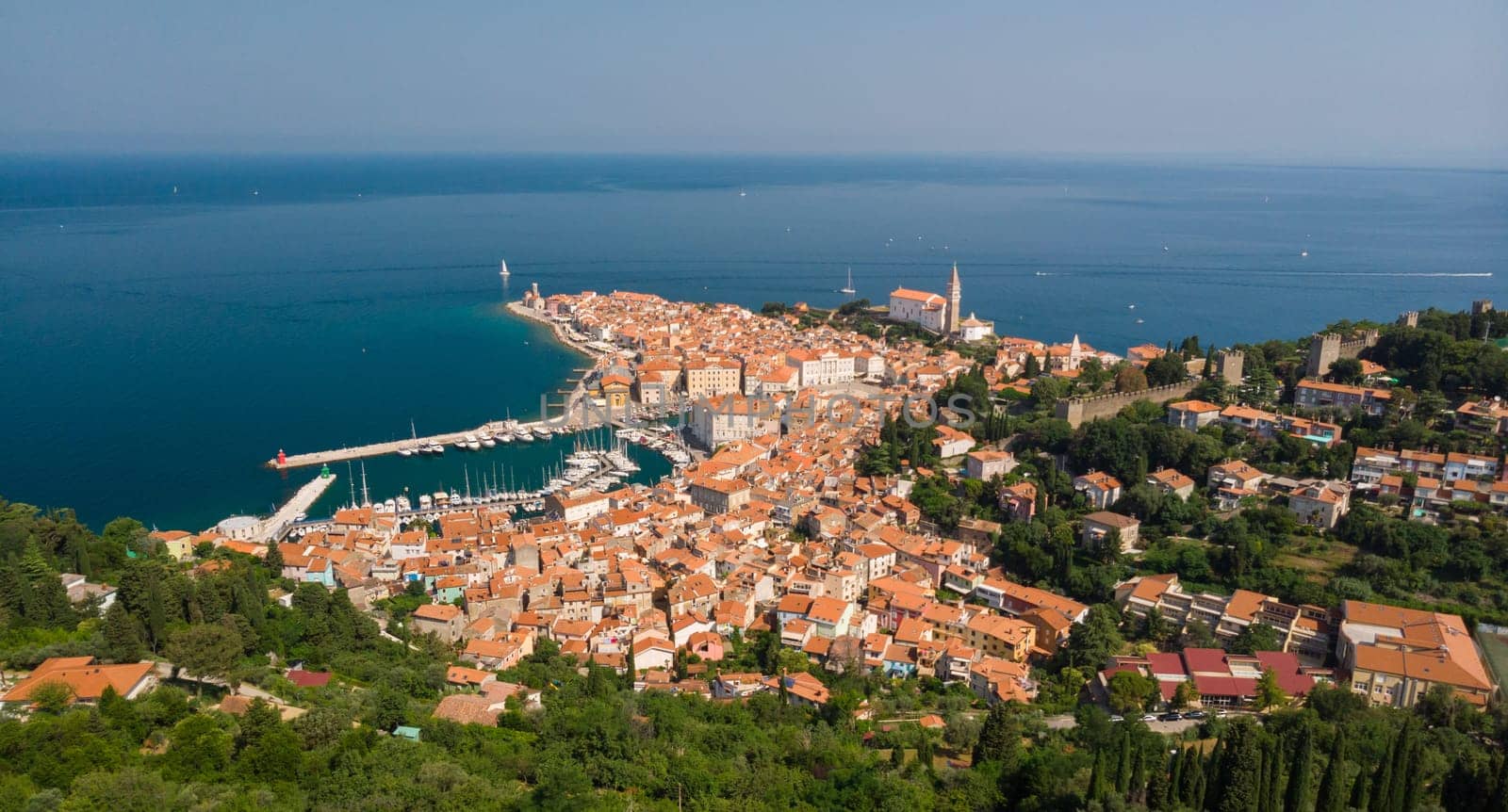 Aerial view of old town Piran. Splendid summer day on Adriatic Sea. Beautiful cityscape of Slovenia, Europe. Traveling concept background. Magnificent Mediterranean landscape.