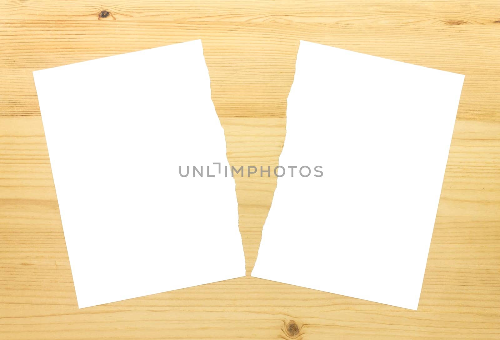 White Ripped Paper in Half on Wood Background. White torn paper 2 part for separate or partition or divide concept