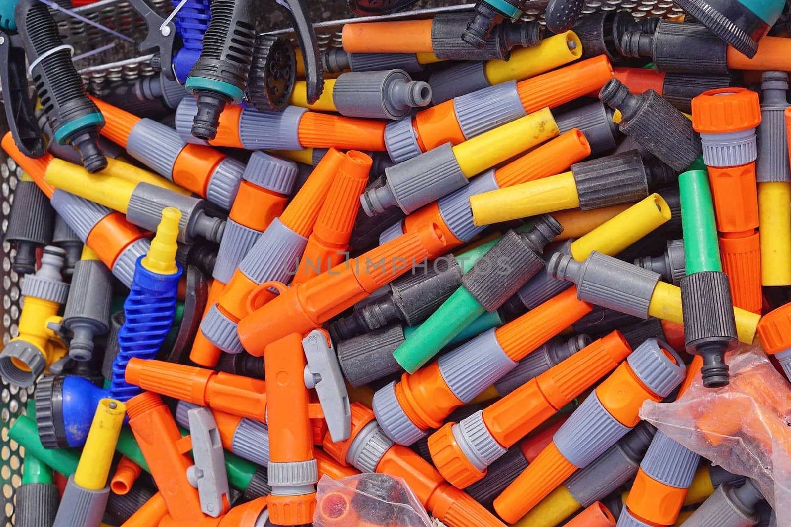Various colorful garden hose nozzles sprayer parts