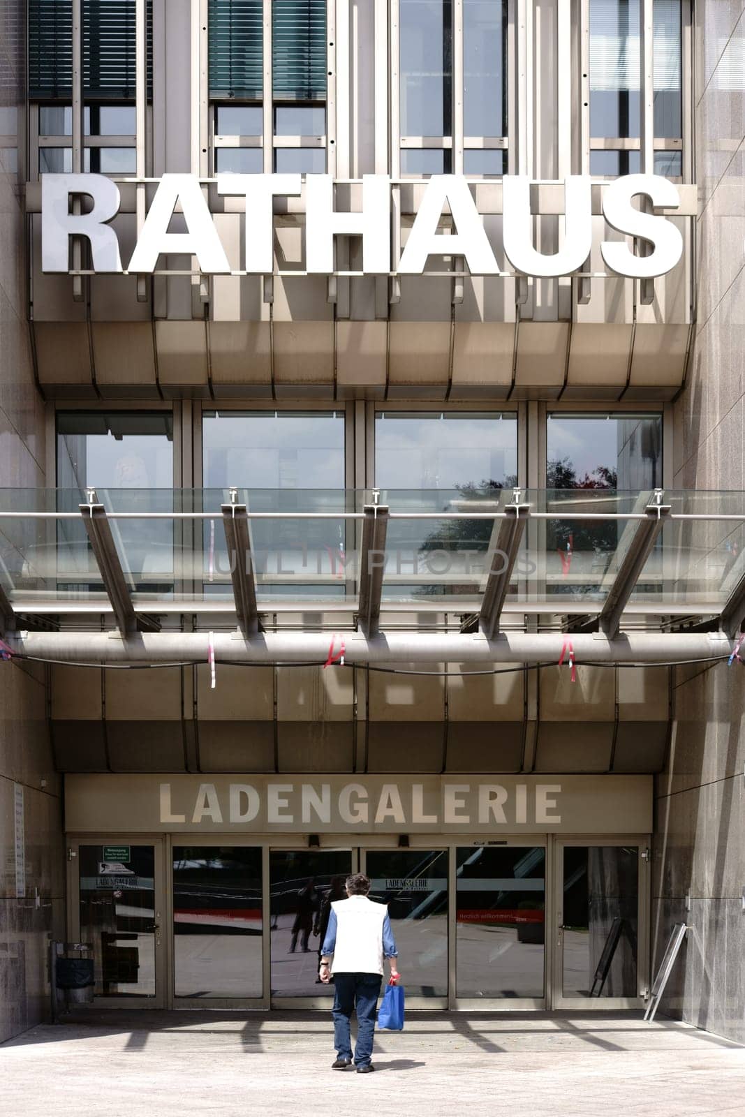 Bad Homburg,Germany - May 19,2018: An unknown man walks into the entrance of the shopping center Rathaus Ladengalerie on May 19,2018 in Bad Homburg.