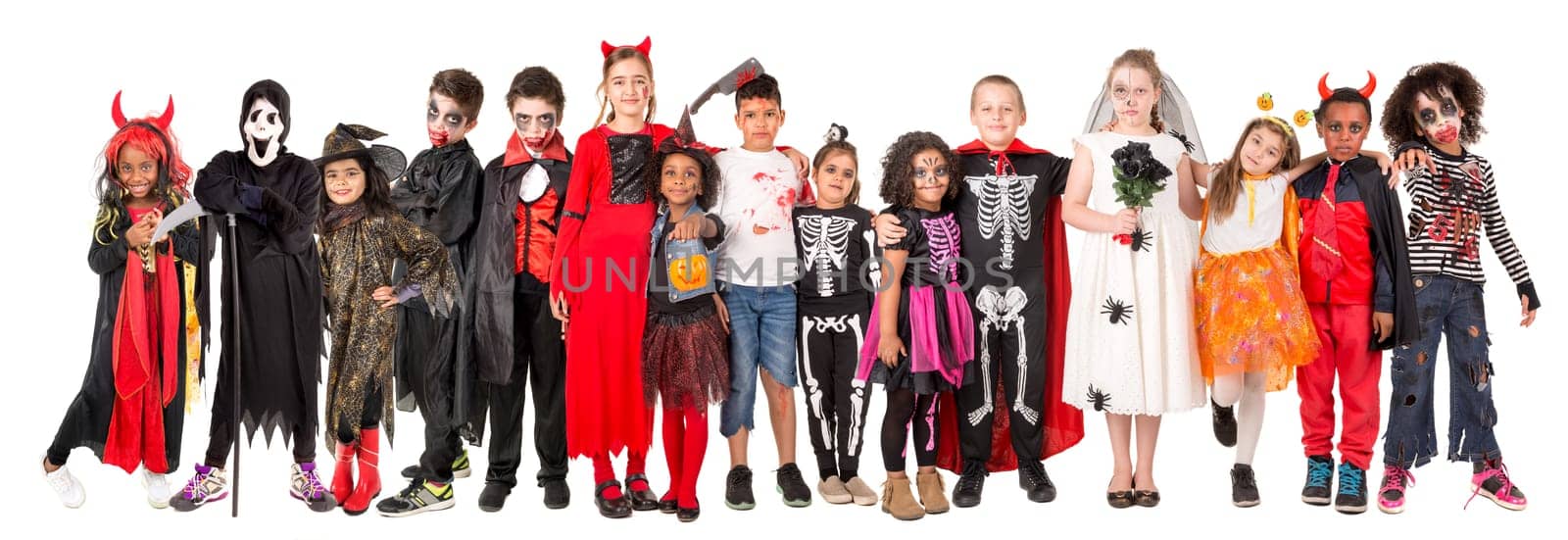 Group of kids in Halloween/Carnaval costumes isolated