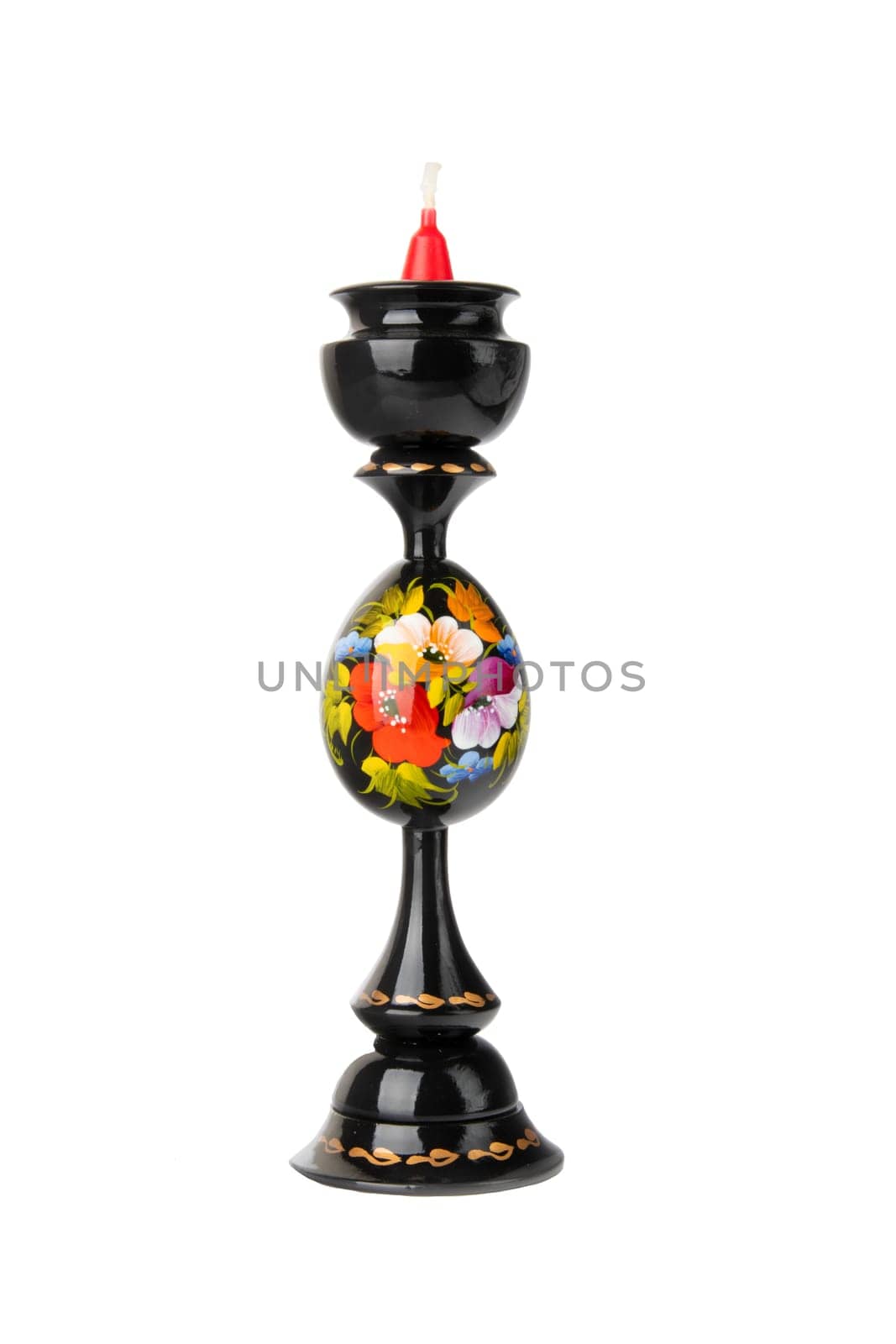 Candlestick. Hand painted colorful wooden candlestick with a candle isolated on white background.