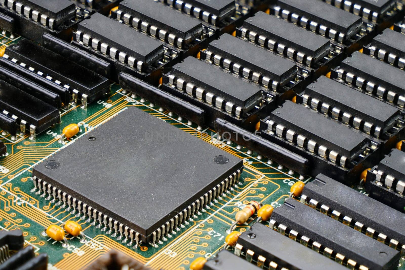 Close-up of electronic components on a circuit board, with shallow depth of field