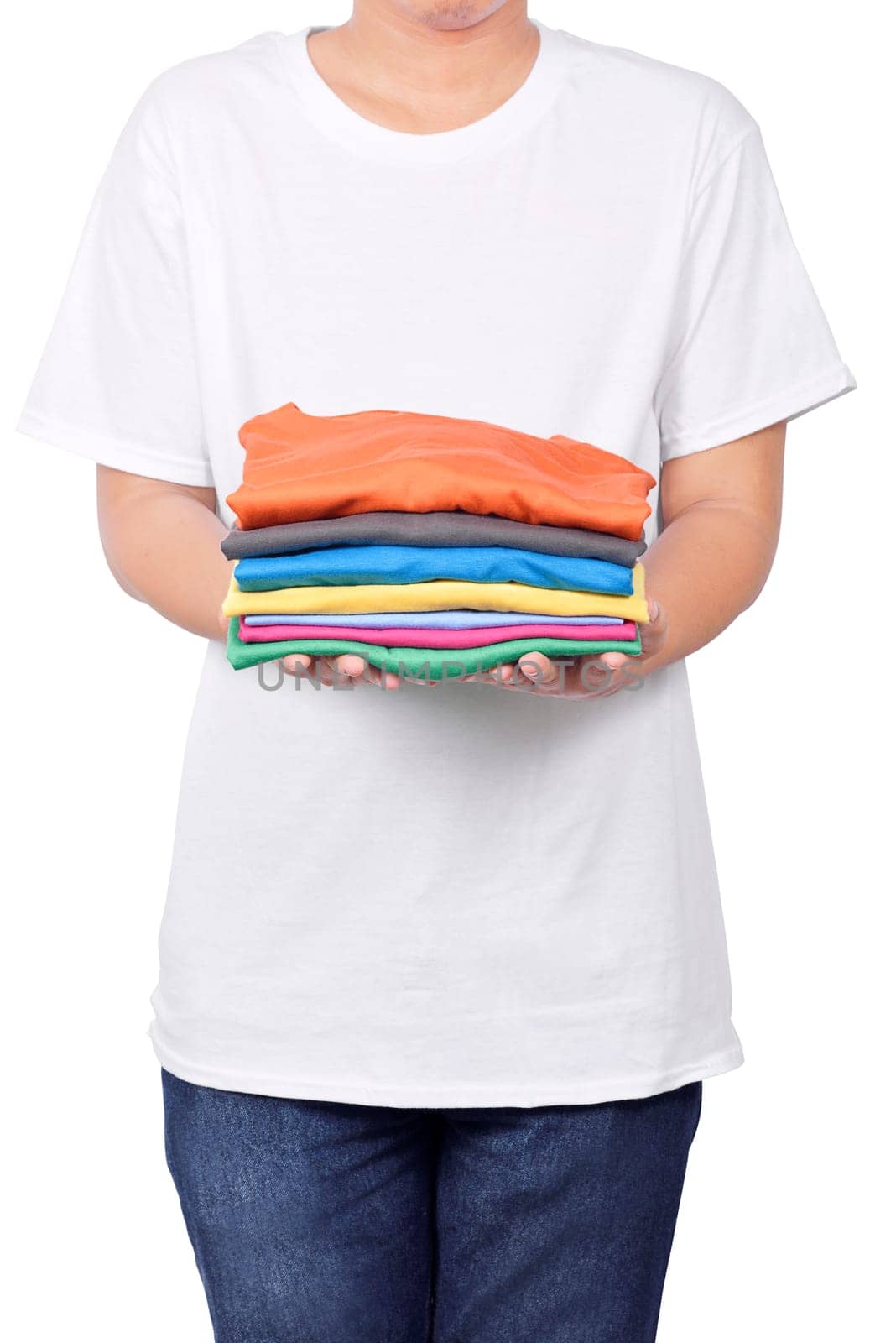 Man holding stack of folded clothes in his hand isolated over white background