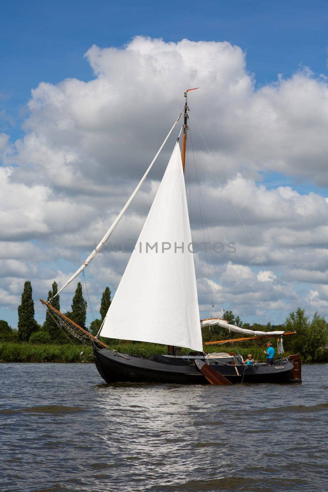 Heeg, Friesland, The Netherlands - August 5, 2018  Dutch traditional ship is sailing near Heeg, Friesland, The Netherlands.