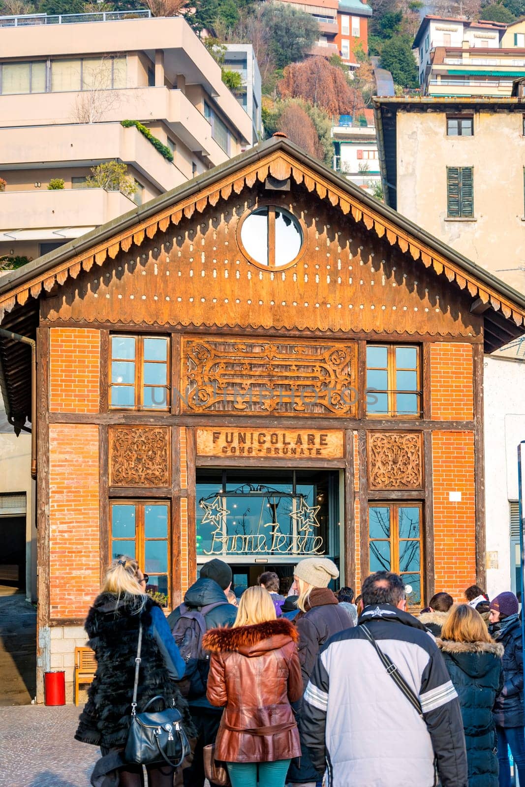 Como, Italy, January 1st 2016: Tourists waiting in queue at the Como funicular transport system station