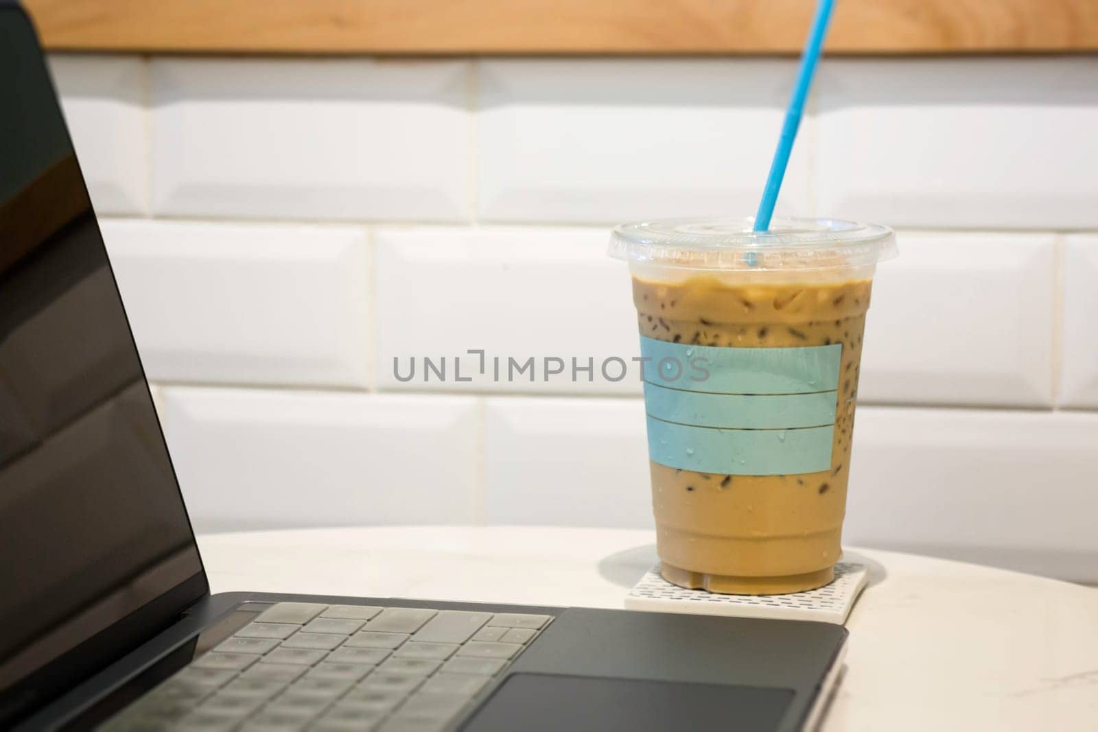 Laptop on table in coffee shop, stock photo