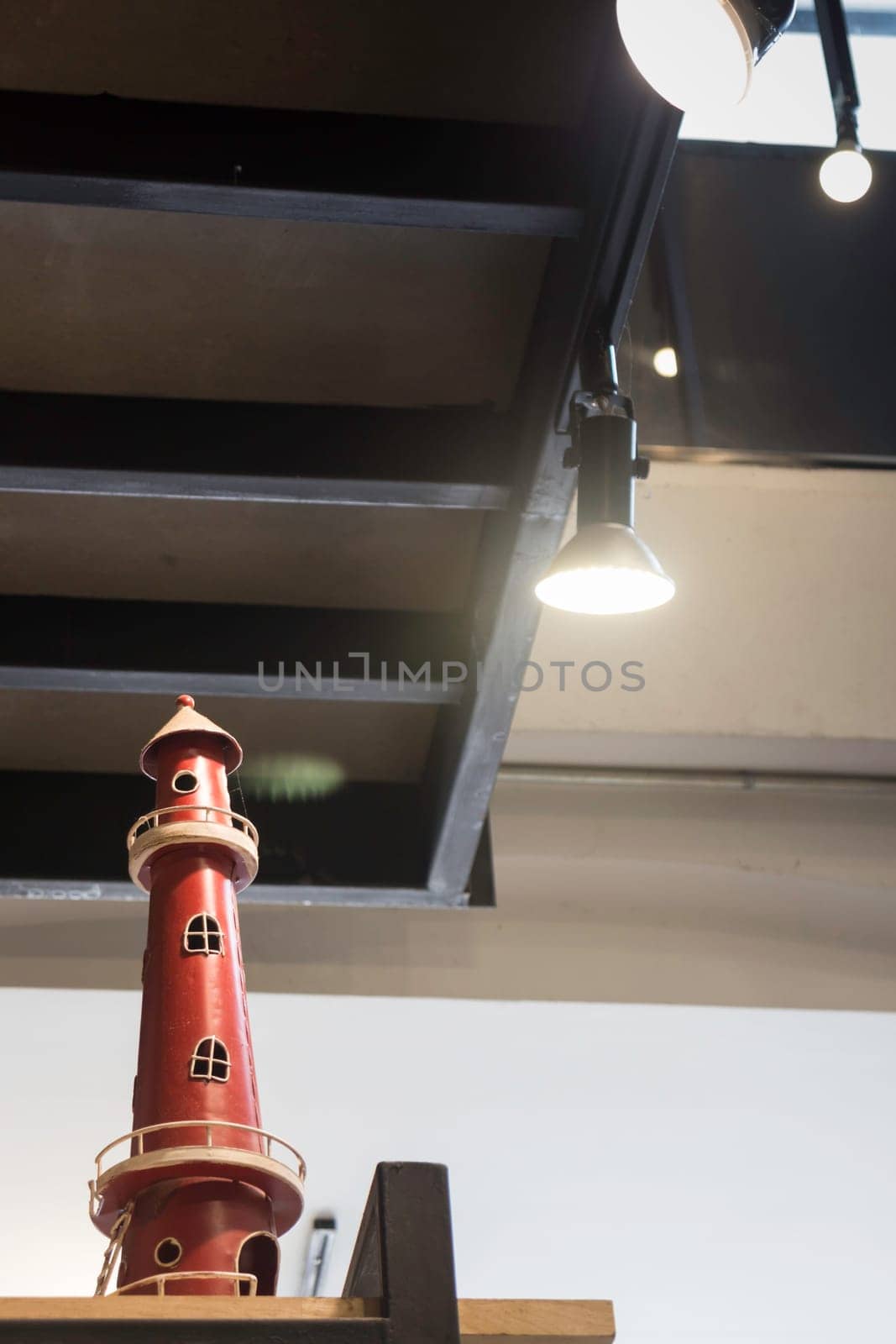 Lighthouse ceramic decorated on shelf, stock photo