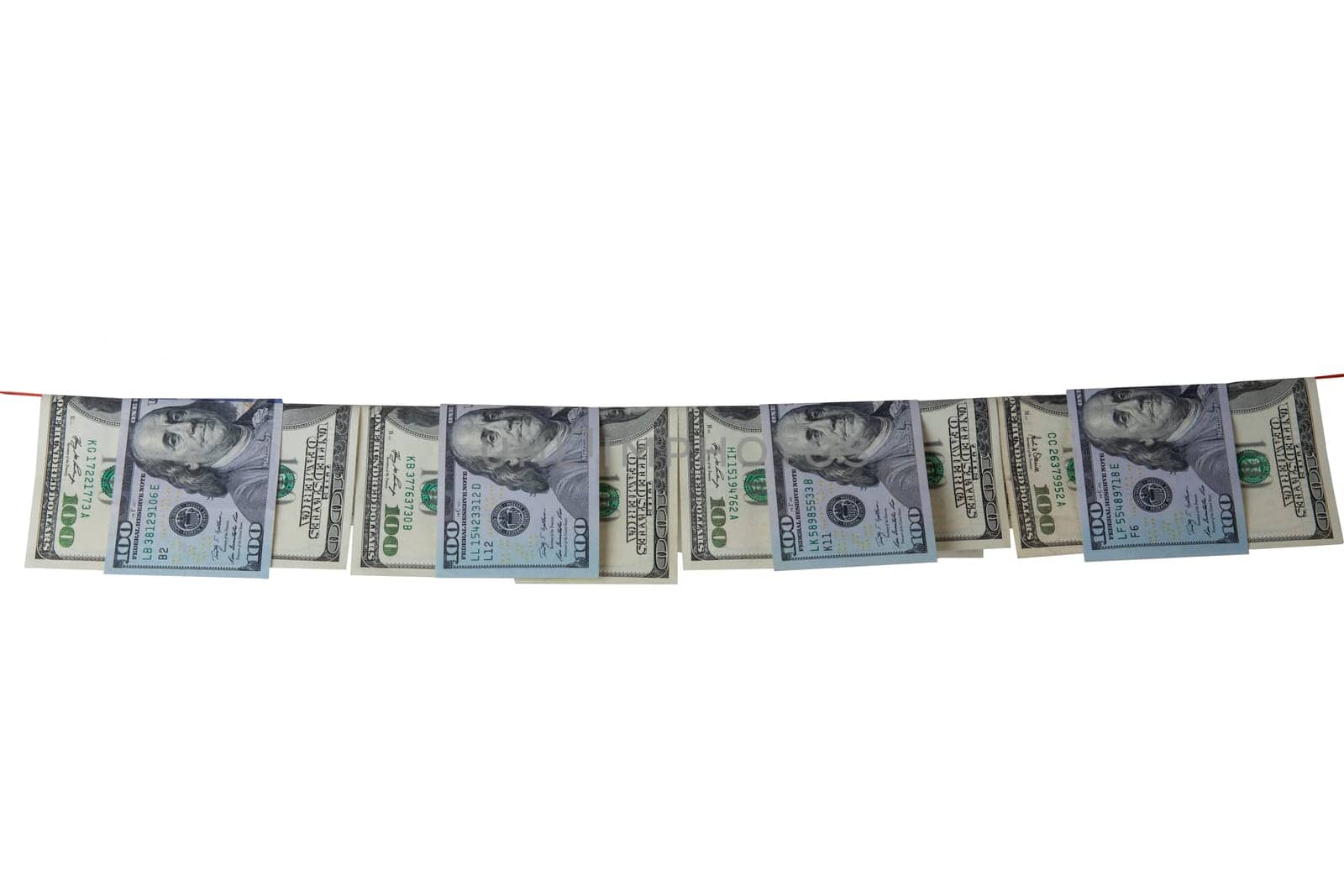 Hundred dollar bills hanging on clothesline are isolated on white background. Concept money laundering.