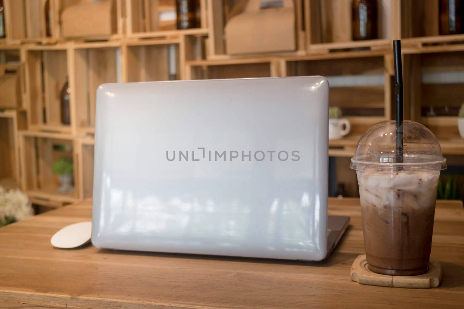 Comfortable work desk with notebook laptop, stock photo