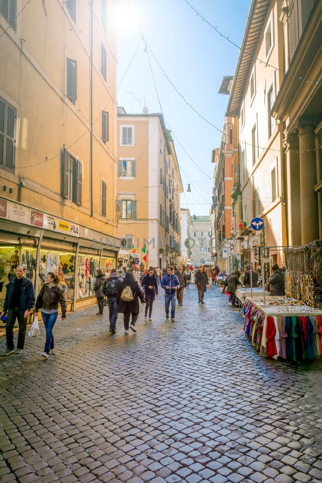 Rome, Italy, December 21st, 2014: People and tourists walking along the ancient Via dei Baullari in Rome, Italy
