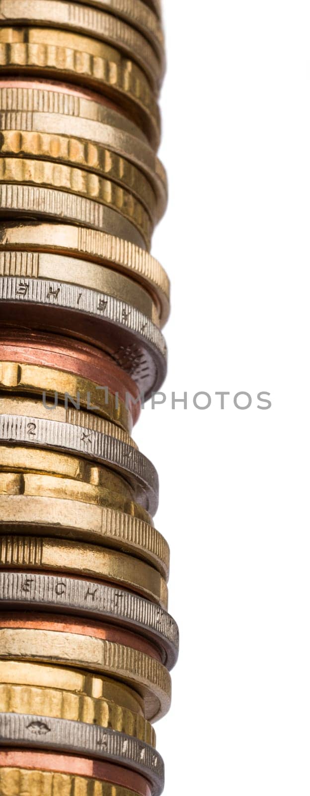 huge tower of different euro coins in close up shot isolated in white background