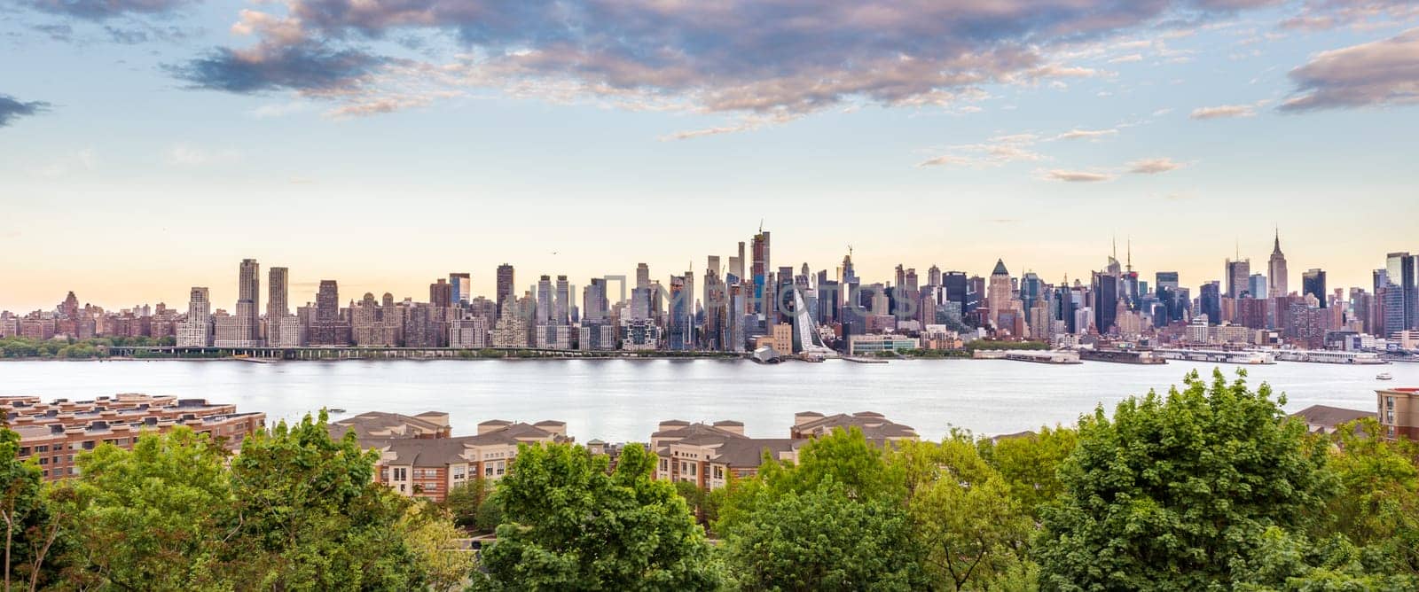 New York City midtown Manhattan skyline panorama view from Boulevard East Old Glory Park over Hudson River.