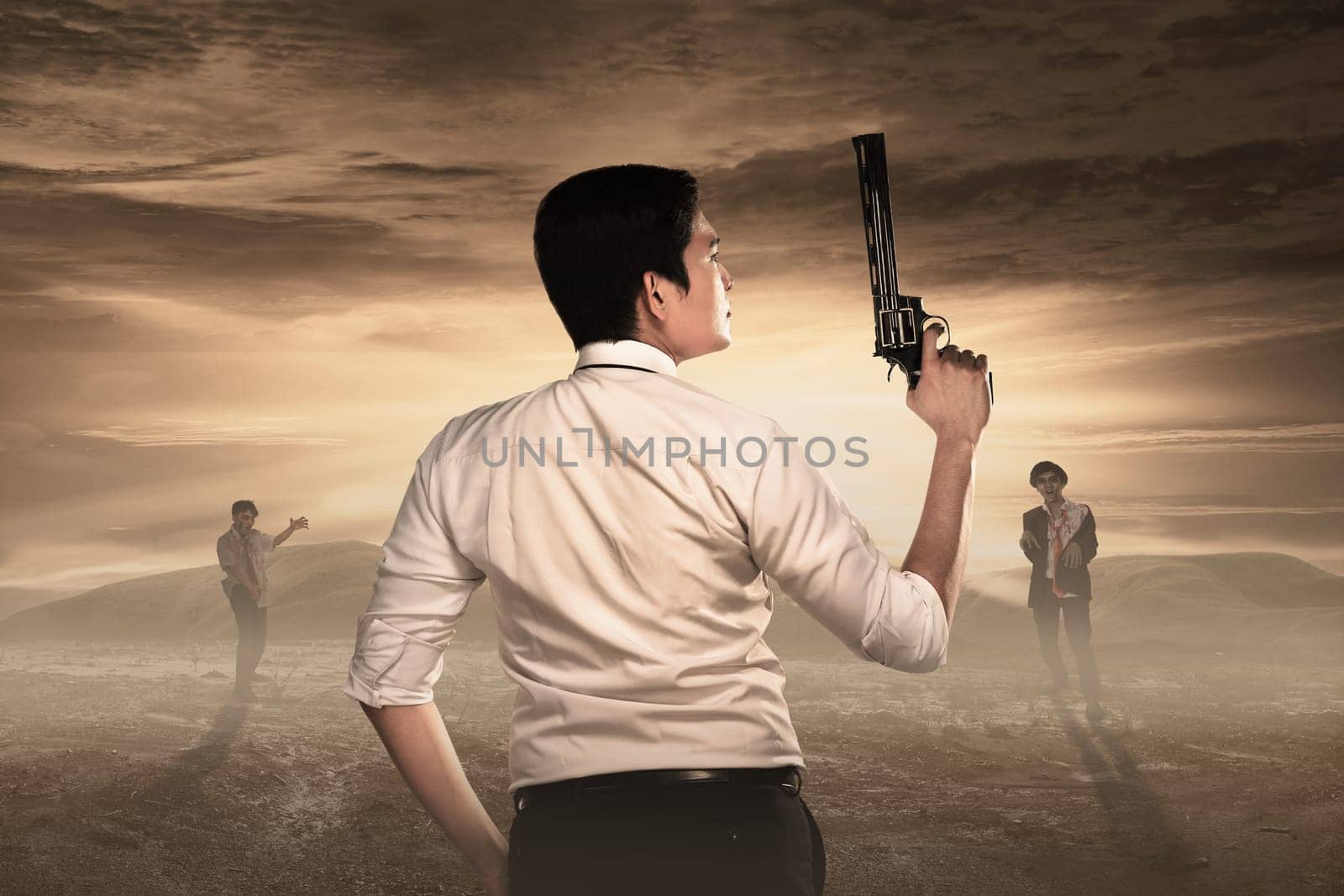 Rear view of man with guns ready to fight against zombies. Halloween concept