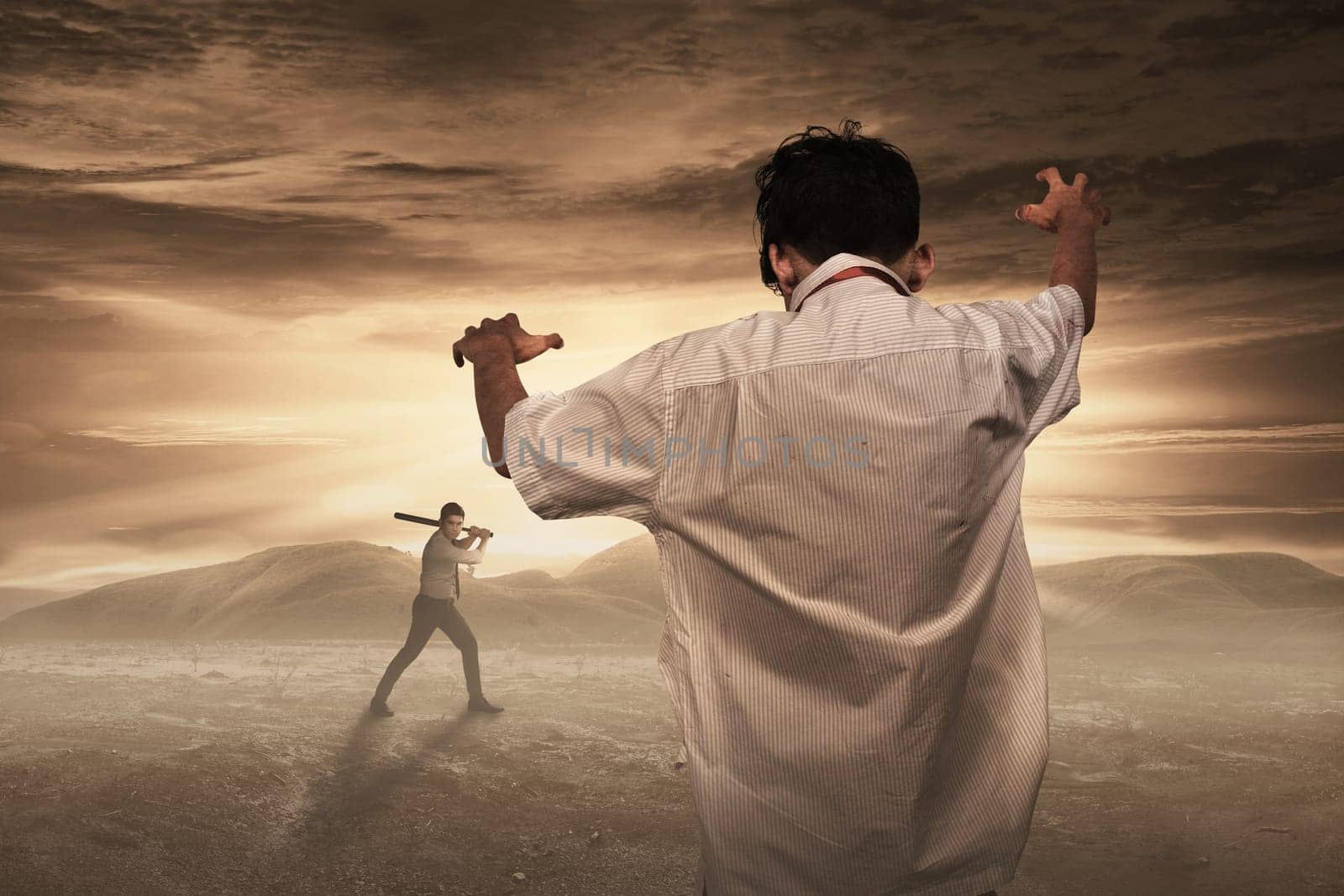 Zombie come to haunt man with baseball bat. Halloween concept
