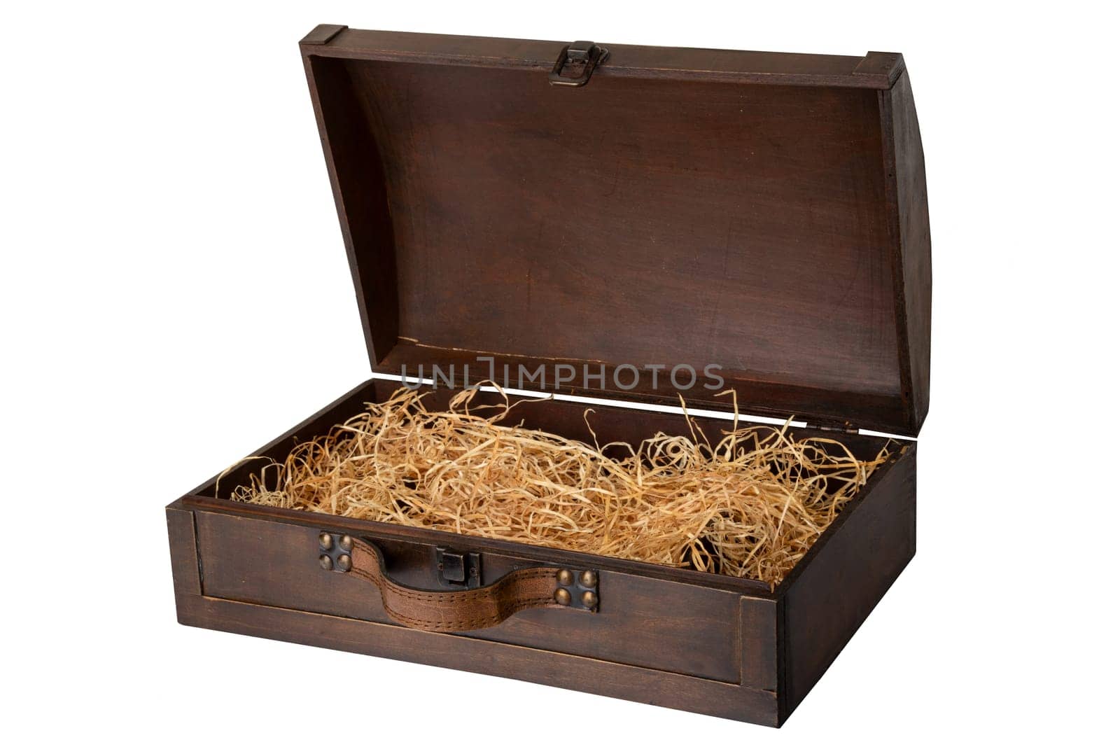 Opened old wooden chest with a leather handle, filled with wood wool isolated on white background. Space for text display montage.