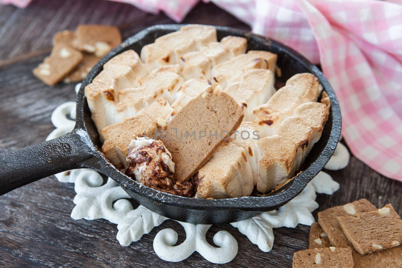 Molten chocolate and toasted marshamallows with cookies for dipping