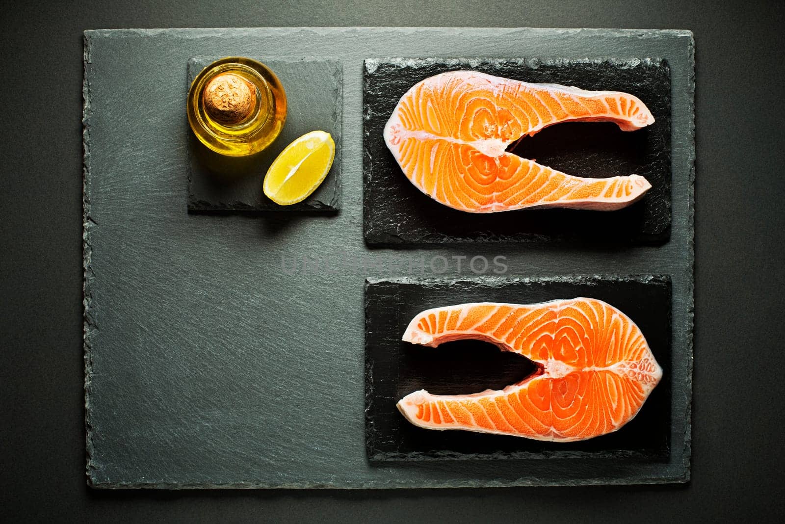 Slices of red salmon fish with spices. Prepare for cooking meal.