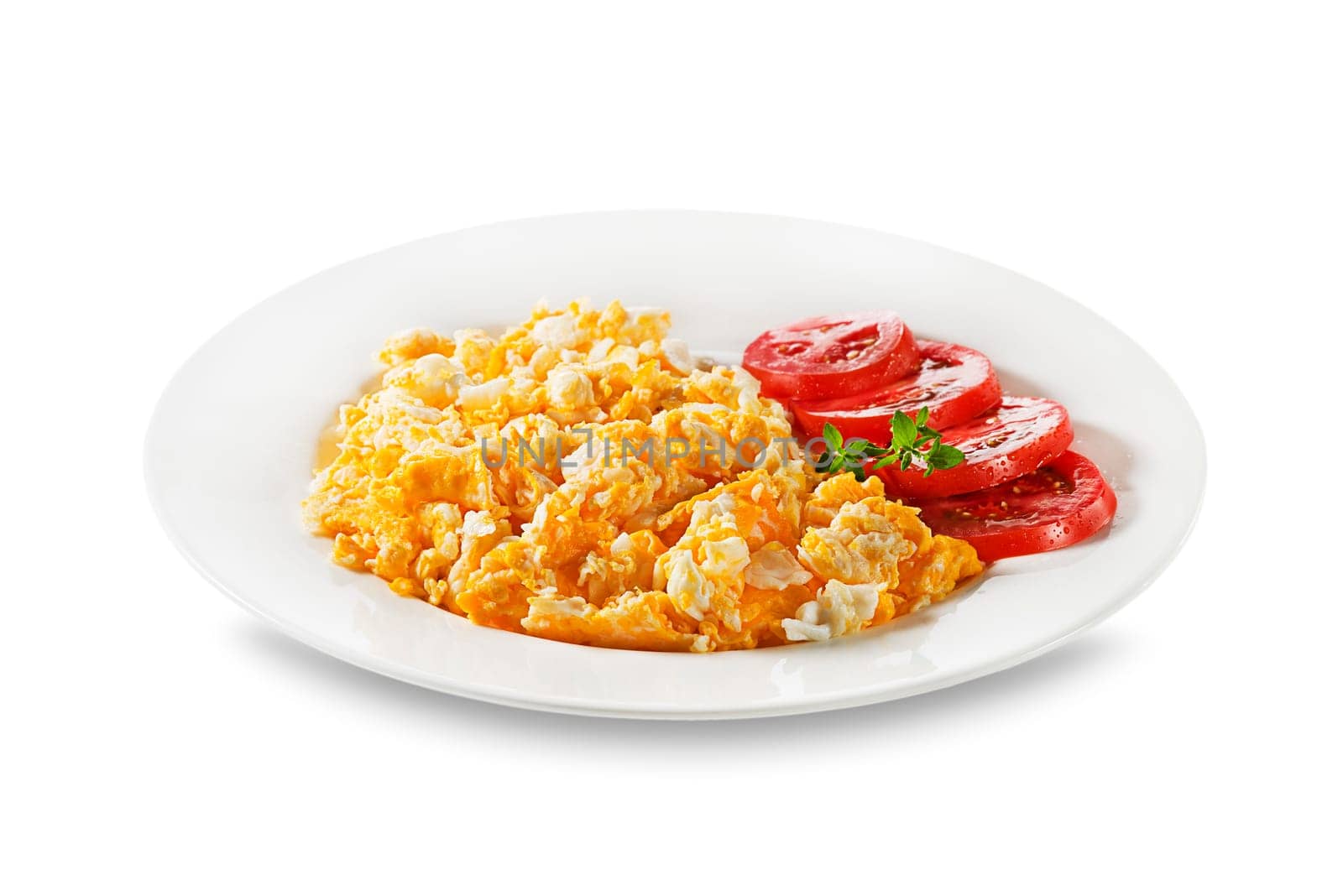 Delish breakfast with Scrambled eggs herbs and tomatoes