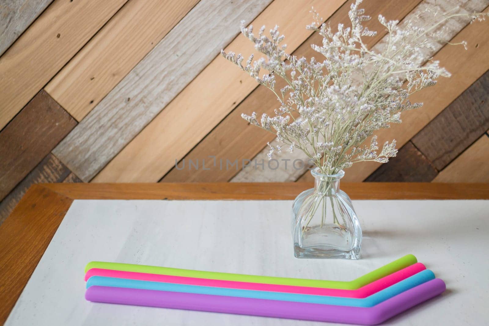 Silicone drinking straw on table, stock photo